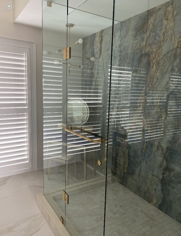 Frameless glass shower with Gold finish hardware installed by Access Glass Inc. in Alliston, Ont