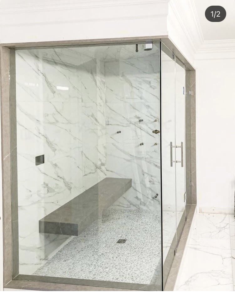 Frameless glass shower with brushed nickel hardware installed by Access Glass Inc. in Barrie, ON